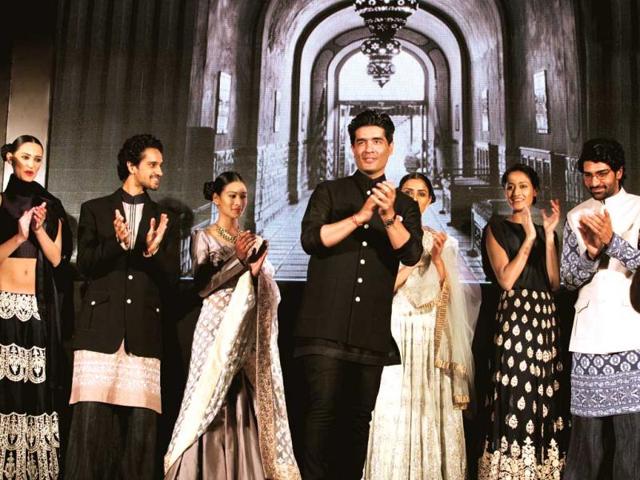 Designer Manish Malhotra with his models after an exclusive showcase of his Mijwan collection.