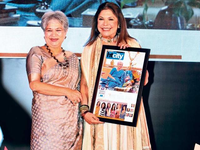 Designer and social activist Laila Tyabji receives the award from designer Ritu Kumar.