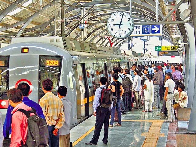 Passengers-board-a-train-at-a-metro-station-in-Delhi-HT-Photo