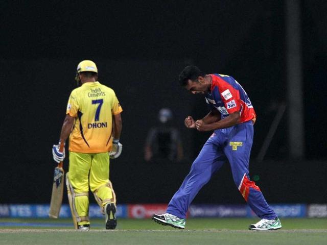 Delhi Daredevils' Jaydev Unadkat celebrates the wicket of Chennai Super Kings' MS Dhoni during their IPL 7 match at the Zayed Cricket Stadium in Sharjah. (PTI Photo)