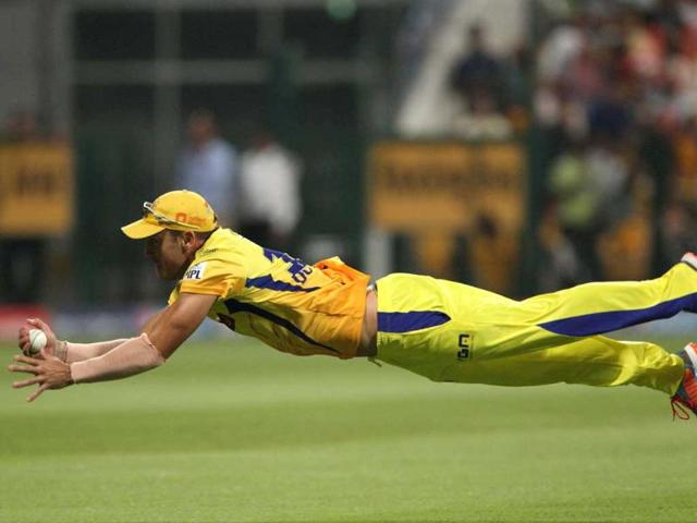 CSK's Faf du Plessis takes a catch to dismiss Manoj Tiwary of Delhi Daredevils during their IPL-7 match at the Zayed Cricket Stadium in Sharjah. (PTI Photo)