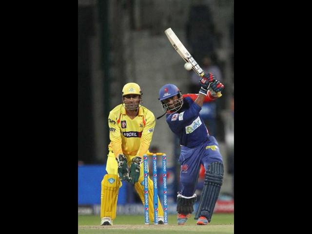 Delhi Daredevils' Dinesh Karthik plays a shot during their IPL 7 match against Chennai Super Kings at the Zayed Cricket Stadium in Sharjah. (PTI Photo)