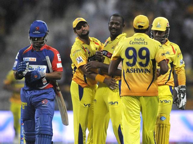 Dwayne Smith of Chennai Super Kings with Suresh Raina, M S Dhoni and Ashwin ccelebrate the wicket of Jean-Paul Duminy of Delhi Daredevils during their IPL 7 match at the Zayed Cricket Stadium in Sharjah. (PTI Photo)