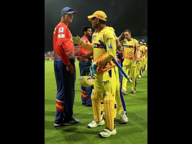 MS Dhoni captain of Chennai Super Kings and Kevin Pietersen of Delhi Daredevils shake hand after their IPL 7 match at the Zayed Cricket Stadium in Sharjah. (PTI Photo)