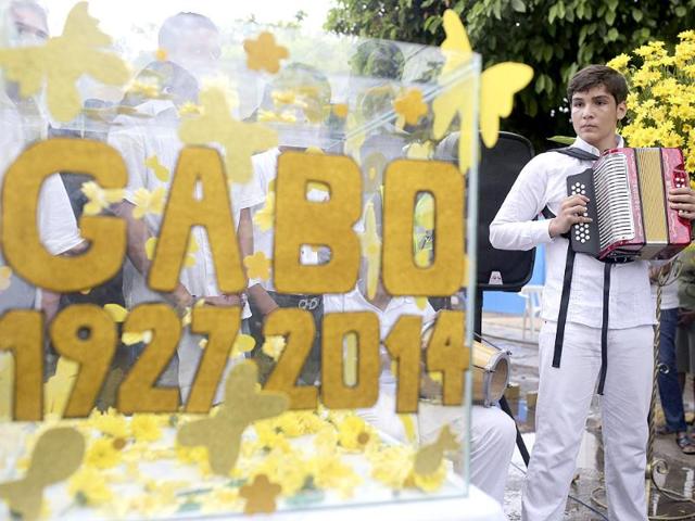 An accordionist looks at a box with messages to the late Colombian Nobel laureate Gabriel Garcia Marquez during a symbolic funeral ceremony in front of the house were he was born in Aracataca, his hometown. (AP Photo)
