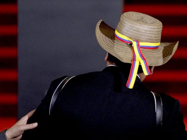 A Colombian musician stands before an urn containing the ashes of late Colombian Nobel laureate Gabriel Garcia Marquez during a public viewing in the Palace of Fine Arts in Mexico City. (Reuters Photo)