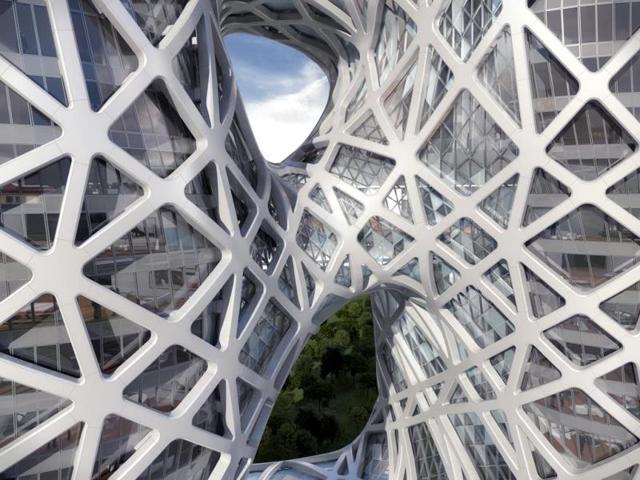 Distinguishing feature: voids and negative spaces carved out of the rectangular block in soft lines: artist renderings reveal an expressive and powerful design: hadid pushes the boundaries of structural engineering to reimagine the standard monolithic rectangular block with voids and negative space carved out of the building’s center, using soft, curved lines. (AFP)
