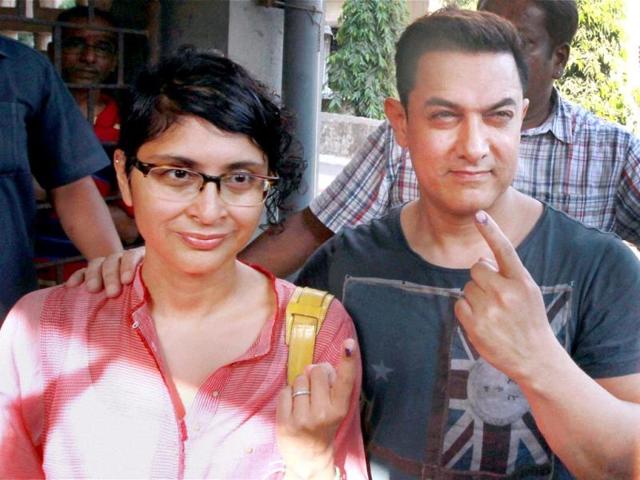 Bollywood actor Aamir Khan with his wife Kiran Rao after casting their vote in Mumbai on Thursday. (PTI)