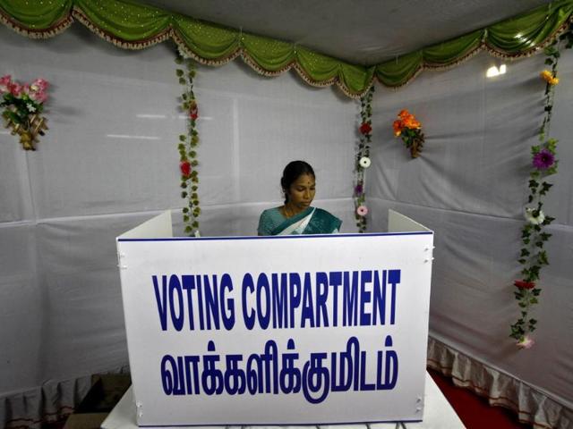 A woman casts her vote at a polling station in Chennai. (Reuters)