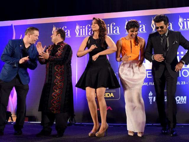 US actor Stephen Baldwin, Rahat Fateh Ali Khan, Sonakshi Sinha, Priyanka Chopra and Anil Kapoor dance to the tune of the IIFA anthem Do Da Tampa on stage during a press conference on the second day of the IIFA awards. (AFP)