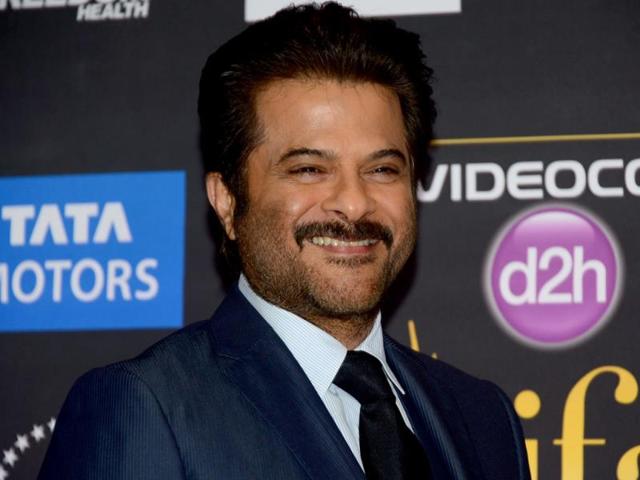 Anil Kapoor poses for the shutterbugs on the green carpet during the press conference. (AFP)