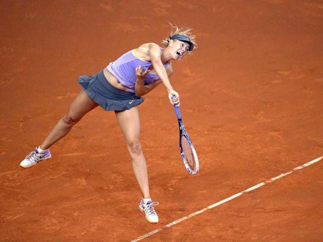 Russia-s-Maria-Sharapova-returns-the-ball-to-Poland-s-Agnieszka-Radwanska-in-their-quarterfinal-at-the-WTA-Porsche-Tennis-Grand-Prix-in-Stuttgart-Germany-AFP-photo