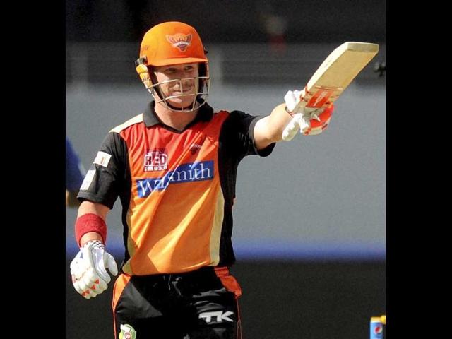 David Warner of the Sunrisers Hyderabad raises his bat after scoring a half century during IPL Season 7 between the Sunrisers Hyderabad and Delhi Daredevils in Dubai (PTI Photo)