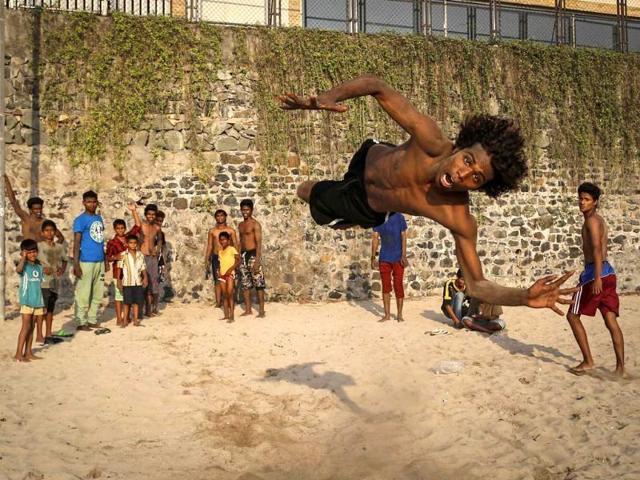Saddam (19) practices stunts at a beach along the Arabian Sea in Mumbai. (Reuters photo)