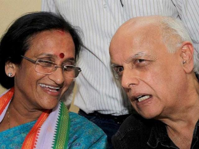 Congress candidate Rita Bahuguna Joshi and Bollywood director Mahesh Bhatt during an election campaign in Lucknow. (PTI photo)