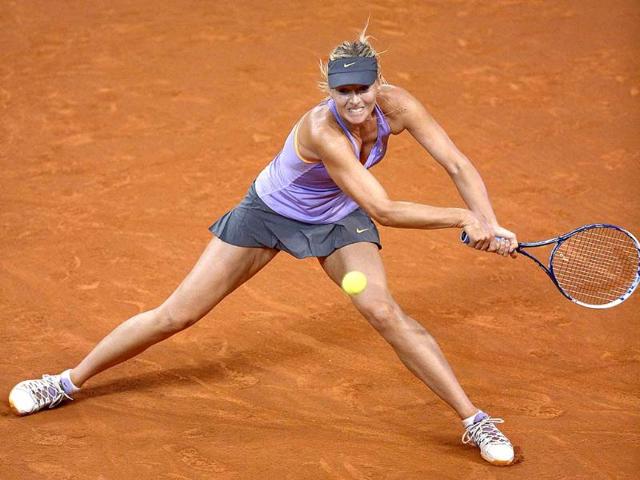 Maria Sharapova returns the ball to Agnieszka Radwanska in their quarterfinal at the WTA Porsche Tennis Grand Prix in Stuttgart, Germany. (AFP photo)