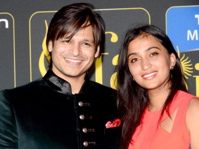 Vivek Oberoi poses with his wife Priyanka at the Mid Florida Credit Union Amphitheater during the IIFA Magic of the Movies show on the third day of the 15th International Indian Film Academy (IIFA) Awards in Tampa, Florida. (AFP)