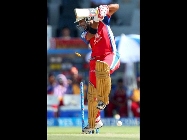 Sachin Rana of Royal Challengers Bangalore is bowled by Shane Watson Rajatshan Royals during during their IPL 7 match in Abu Dhabi. (PTI Photo)