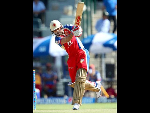 Virat Kohli of Royal Challengers Bangalore plays a shot during their IPL 7 match against Rajatshan Royals in Abu Dhabi. (PTI Photo)