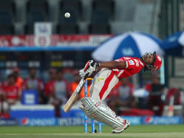 Kings XI Punjab's Wriddhiman Saha avoids a delivery from Morne Morkel of Kolkata Knight Riders during their IPL7 match in Abu Dhabi. (PTI Photo)
