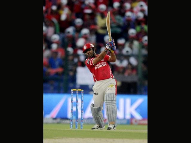 Kings XI Punjab's Virender Sehwag plays a shot against Kolkata Knight Riders during their IPL7 match in Abu Dhabi. (PTI Photo)