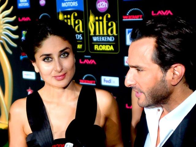 Bollywood stars Kareena Kapoor (L) and Saif Ali Khan (R) meet the press and fans on the green carpet at the Raymond James Stadium on the fourth and final day of the 15th International Indian Film Academy (IIFA) Awards in Tampa, Florida. (AFP)