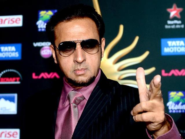 Bollywood actor Gulshan Grover stikes a pose on the green carpet at the Raymond James Stadium on the fourth and final day of the 15th International Indian Film Academy (IIFA) Awards in Tampa, Florida. (AFP)