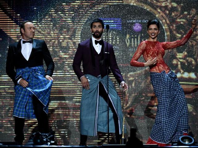 (From L-R) US actor Kevin Spacey, Bollywood actor Shahdid Kapoor (C) and Bollywood actress Deepika Padukone perform on stage at the Raymond James Stadium on the fourth and final day of the 15th International Indian Film Academy (IIFA) Awards in Tampa. AFP PHOTO
