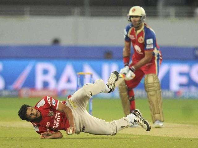 Kings X1 Punjab's Rishi Dhawan fields during a T20 match against Royal Challengers Bangalore during the Indian Premier League 2014 at the Dubai International Stadium, Dubai, United Arab Emirates on Monday. (PTI Photo)