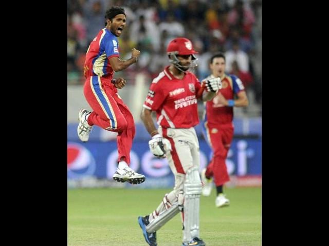 Ashoke Dinda of the Royal Challengers Bangalore celebrates the wicket of Cheteshwar Pujara of the Kings X1 Punjab during their IPL 7 match in Dubai on Monday.(PTI Photo)