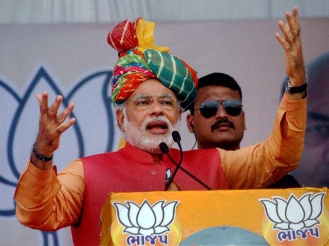 BJP's PM candidate Narendra Modi addresses an election campaign rally in Anand. (PTI photo)