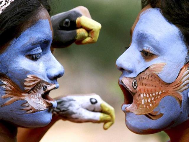 Children show their skills after a hand-face painting camp at the planetarium in Kozhikode (PTI Photo)