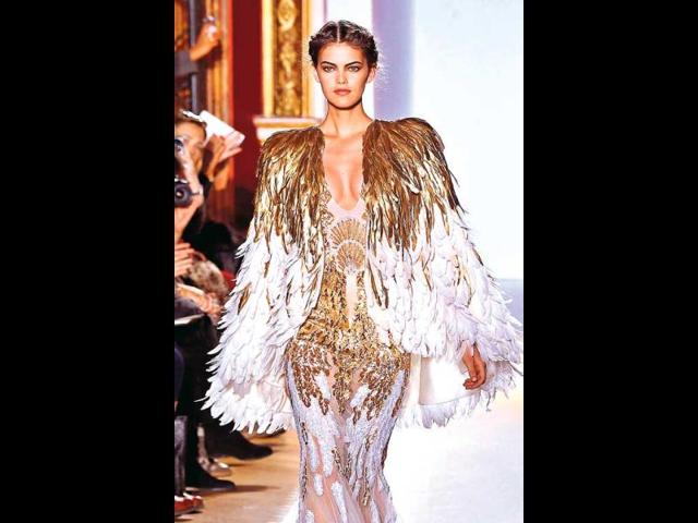 From vintage-infused capelets to full-fledged capes that cascade down from the shoulders, and finish with a train at the back. The cape has been hot for a few seasons now, so if you haven’t experimented yet, now is the time. Take some visual inspiration:Playing with plumes: Lebanese fashion designer Zuhair Murad has often adorned his designs with gilded capes that make for charming, super glamorous creations. We loved this plume-perfect design from his haute couture Paris, spring 2013 collection. We can imagine some of our Bollywood ladies looking red carpet-perfect in this one! (HT PHOTO)