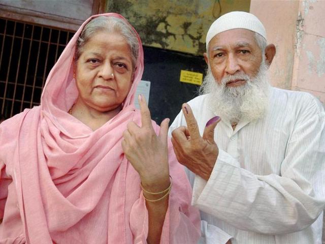A Muslim couple after casting their votes for Lok Sabha polls in Surat. (PTI photo)