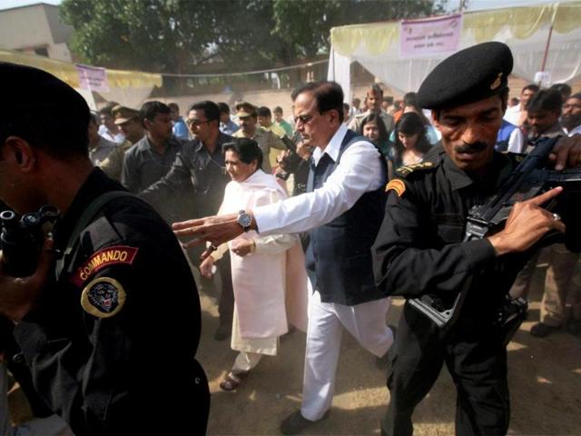 BSP supremo Mayawati along with party leader Satish Chandra Mishra coming out after casting votes for Lok Sabha polls at a polling station in Lucknow. (PTI photo)