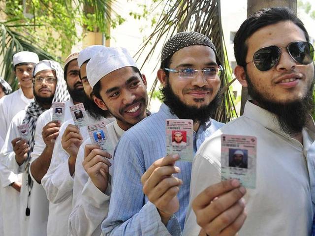 Young Muslim voters show voter ID card after casting their vote at old city in Lucknow, India. (Deepak Gupta/HT Photo)