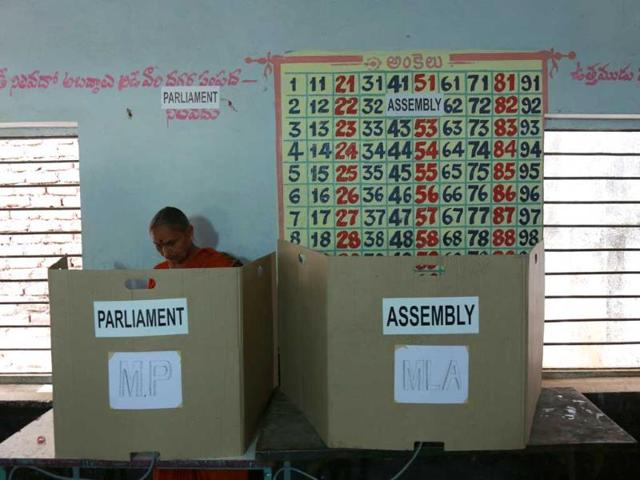 Women cast their vote at a polling station on the outskirts of Hyderabad. (Results Photo)