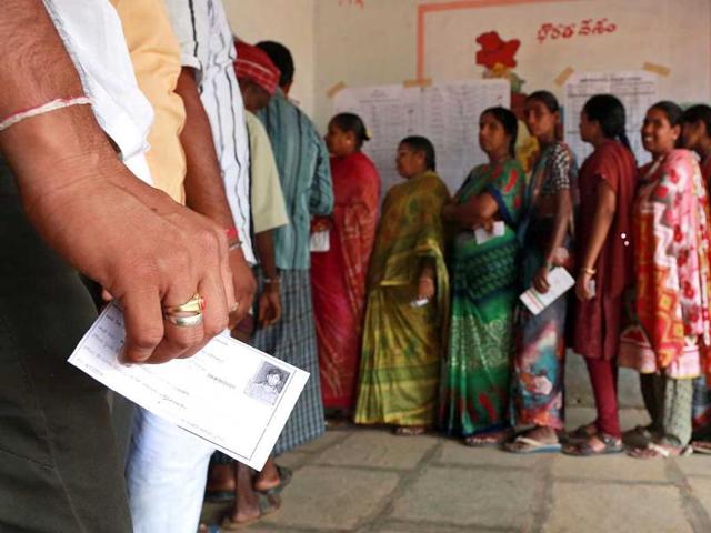 Voters stand in queue to cast their votes at a polling station on the outskirts of Hyderabad. (Reuters Photo)