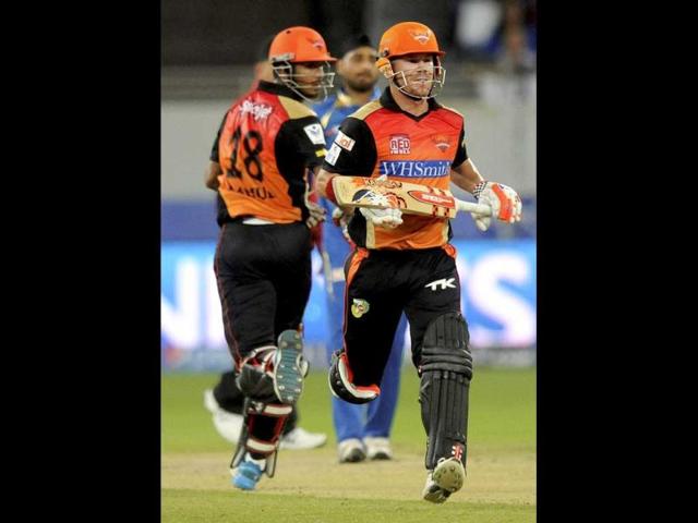 KL Rahul and David Warner of Sunrisers Hyderabad run between the wickets during their IPL 7 match against Mumbai Indians in Dubai. (PTI Photo)
