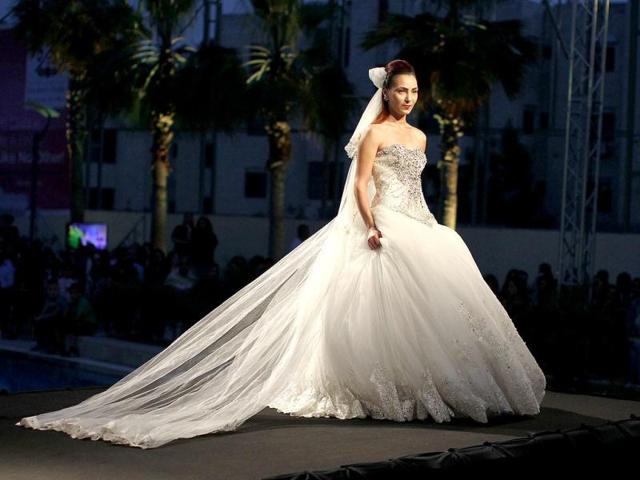 A Palestinian model displays a creation during the first day of the Palestinian Fashion Week in the West Bank city of Ramallah. (AFP) A Palestinian model displays a creation during the first day of the Palestinian Fashion Week in the West Bank city of Ramallah. (AFP)