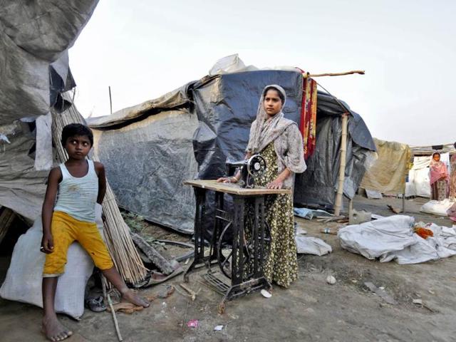 For the past two years Shakila Bibi (36), a riot victim, has been living in a relief camp in Joyma area of Kokrajhar with her four daughters and husband after her property was burnt down during the 2012 riots. To survive in the camp, Shakila has taken up tailoring while her husband pulls rickshaw. (Subrata Biswas/HT Photo)