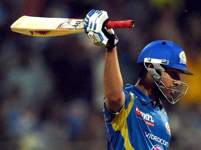 Rohit-Sharma-of-Mumbai-Indians-raises-his-bat-after-scoring-a-half-century-during-their-IPL-7-match-against-Royal-Challengers-Bangalore-in-Mumbai-PTI-Photo Rohit-Sharma-of-Mumbai-Indians-raises-his-bat-after-scoring-a-half-century-during-their-IPL-7-match-against-Royal-Challengers-Bangalore-in-Mumbai-PTI-Photo