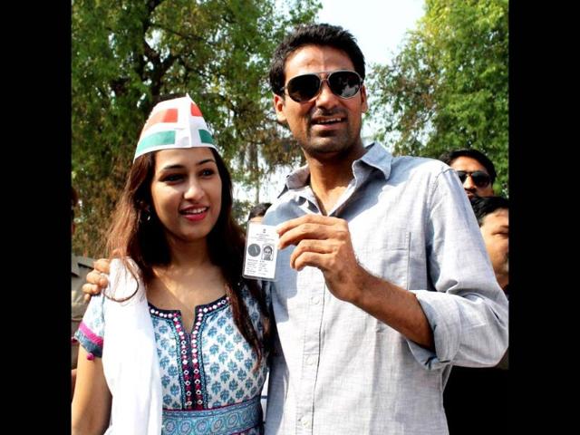 Congress candidate Mohd Kaif for Phulpur seat with his wife Pooja Yadav after casting vote. (PTI photo)