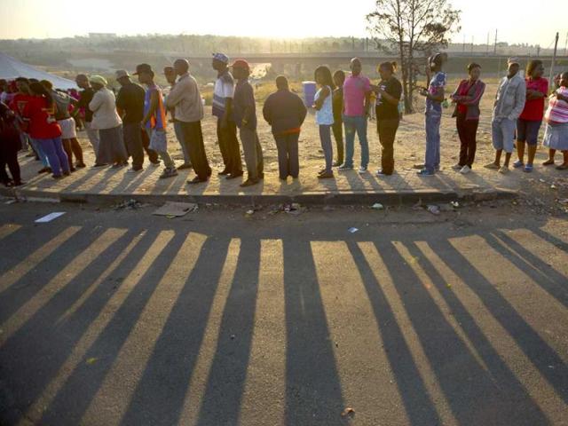 South Africans queue to cast their votes at a polling station in the Alexandra township of Johannesburg, South Africa. (AP Photo)