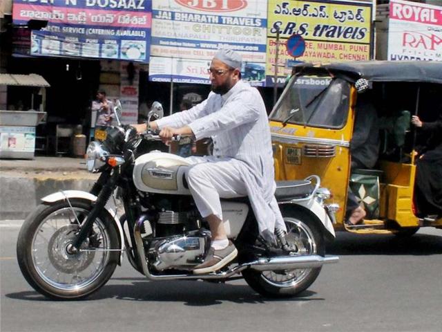 MIM president Asaduddain Owaisi riding his bike in Hyderabad . (PTI Photo)