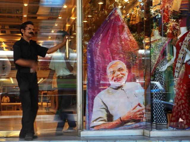 A saree with a print of BJP's PM candidate, Narendra Modi on sale at a shop in Dadar. (HT photo/Kalpak Pathak)