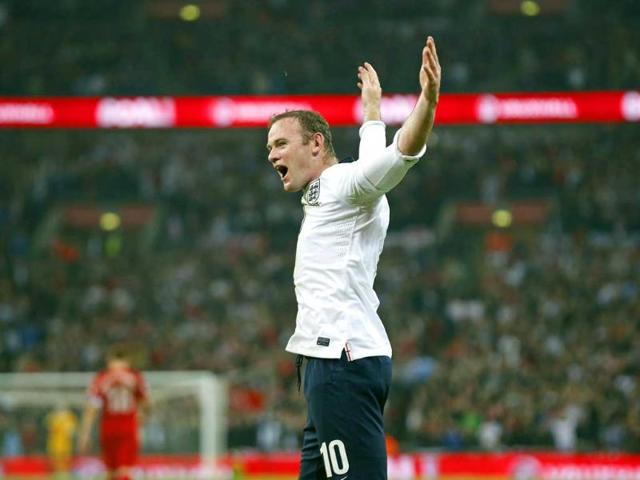 England-s-Wayne-Rooney-celebrates-after-scoring-the-opening-goal-during-the-World-Cup-Group-H-qualification-soccer-match-between-England-and-Poland-at-Wembley-stadium-in-London-AP-Photo