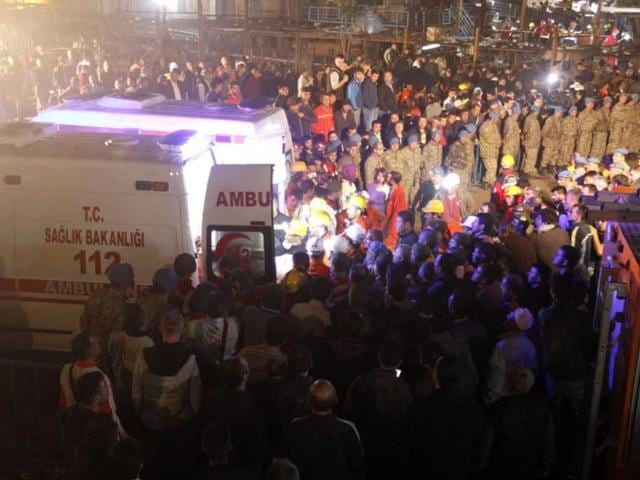Body of a miner carried to an ambulance in Soma, a district in Turkey's western province of Manisa. (Reuters Photo)