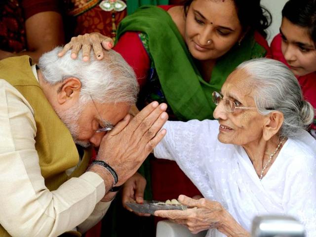 BJP-prime-ministerial-candidate-Narendra-Modi-C-greets-well-wishers-at-the-home-of-his-mother-Hira-Ba-in-Gandhinagar-AFP-Photo BJP-prime-ministerial-candidate-Narendra-Modi-C-greets-well-wishers-at-the-home-of-his-mother-Hira-Ba-in-Gandhinagar-AFP-Photo