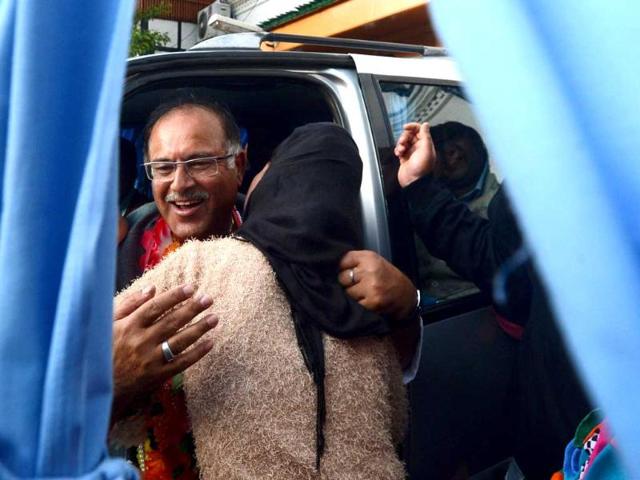 People's Democratic Party (PDP) candidate for Srinagar Tariq Hamid Karra hugs a supporter as he celebrates his election result in Srinagar. (AFP Photo)